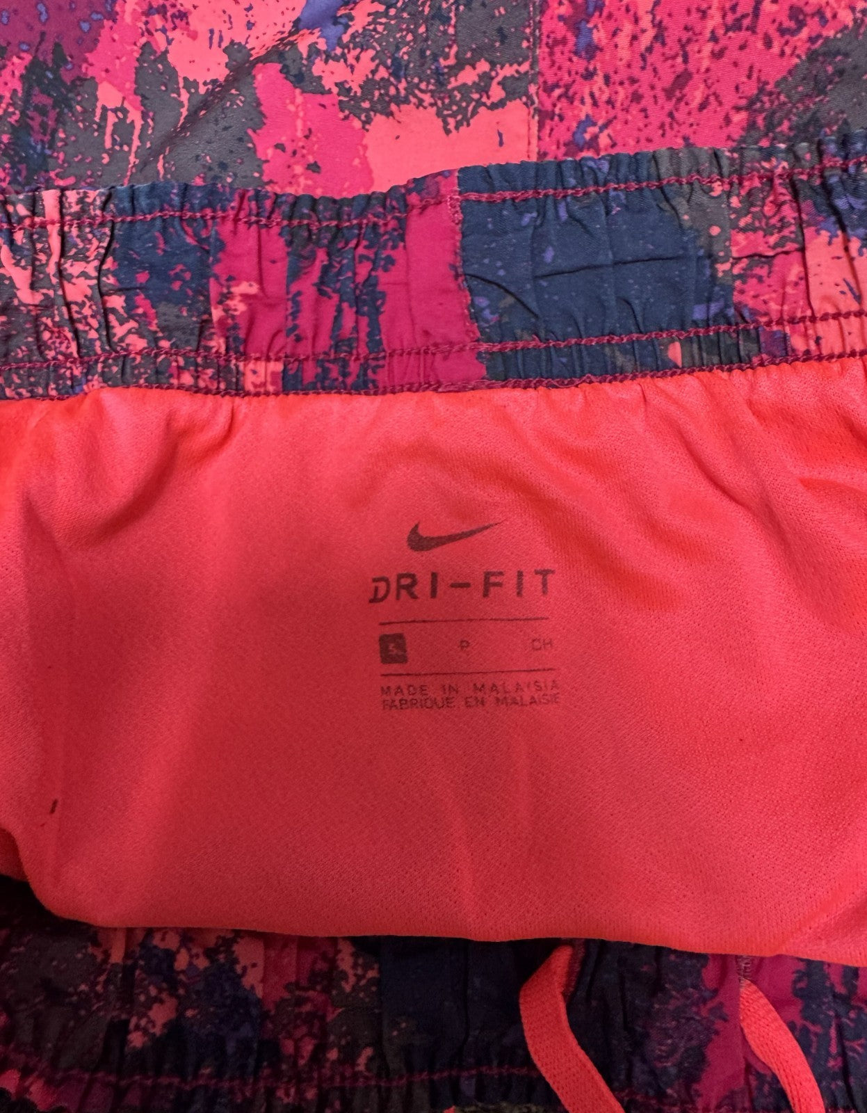 Nike Dri-FIT Running Shorts Womens Small 25" Waist Multi Splatter Dolphin Hem