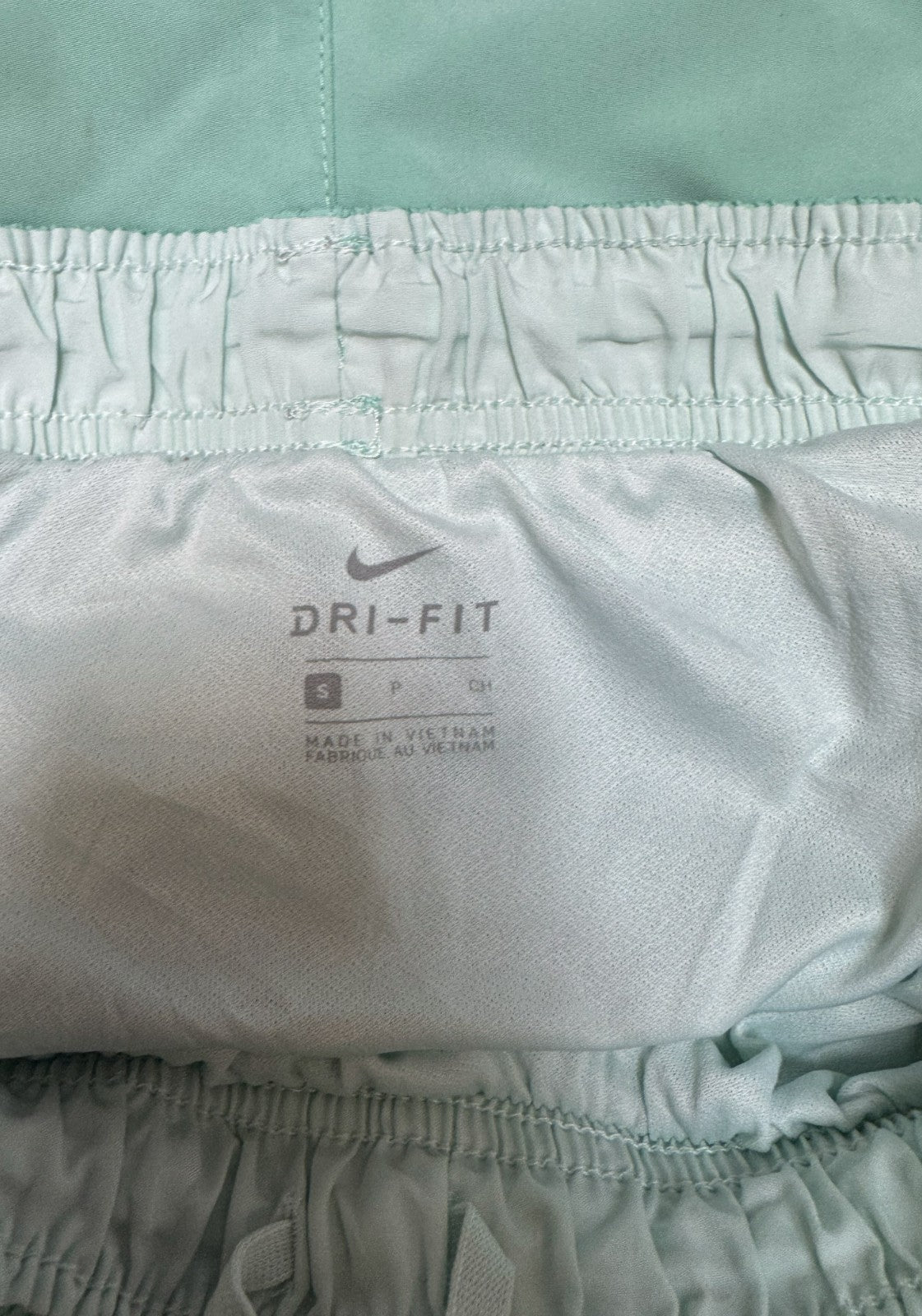 Nike Dri-FIT Running Shorts Womens S 25" Waist Mint Green Dolphin Hem Drawstring